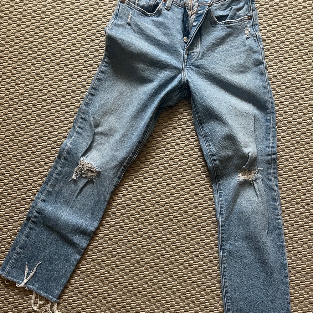 Distressed Levi’s blue jeans
